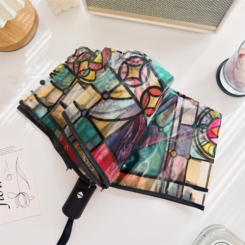 Transparante paraplu met glas-in-loodraampatroon