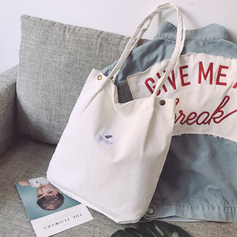 Corduroy draagtas met letterpatch