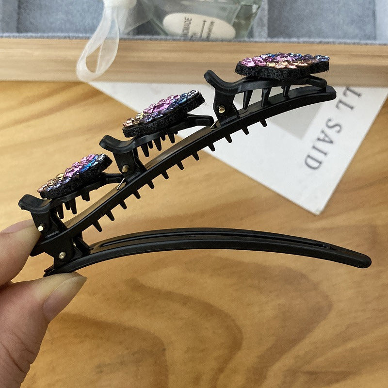 Haarclip met drie bloemen aan de zijkant