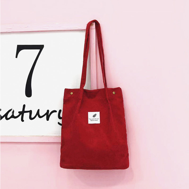 Corduroy draagtas met letterpatch