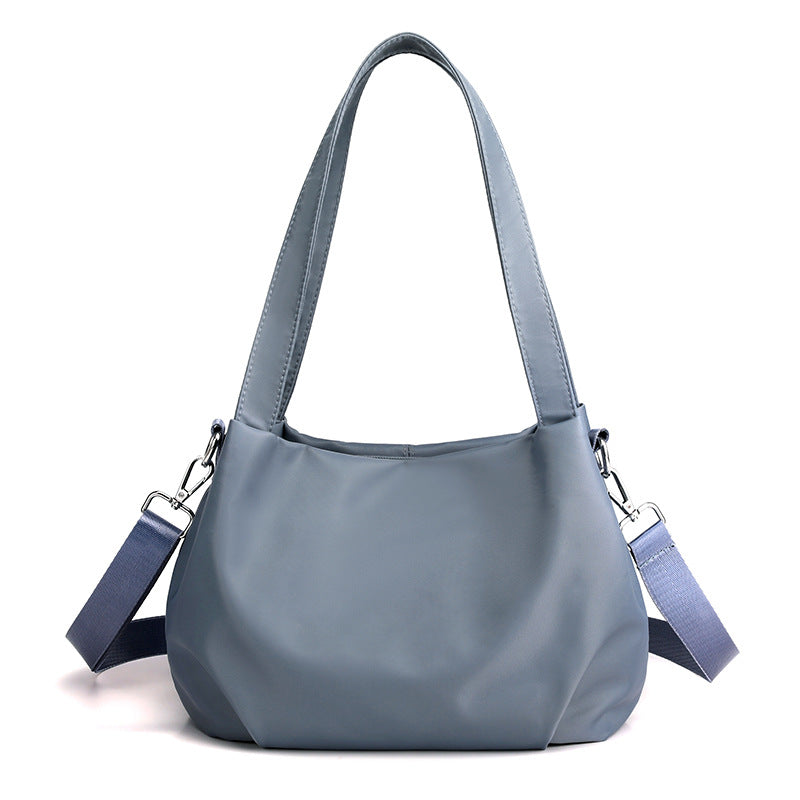 Schouder- en crossbody-lichte en veelzijdige vrijetijdstas