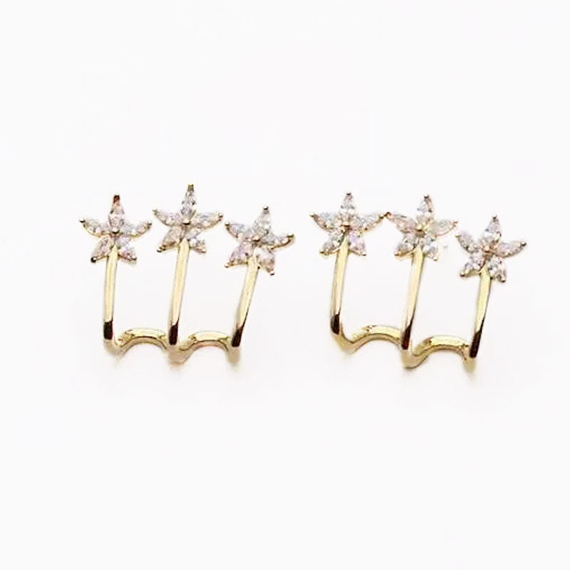 Drie bloem een doorboorde oorbellen