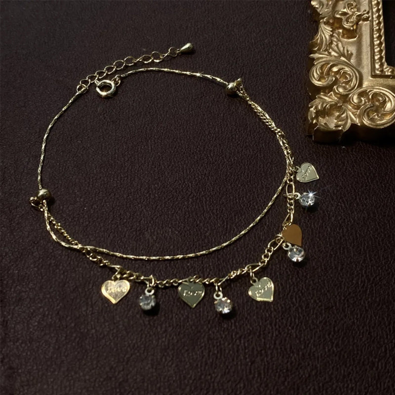 Hart enkelbandje met dubbele laag strass steentjes