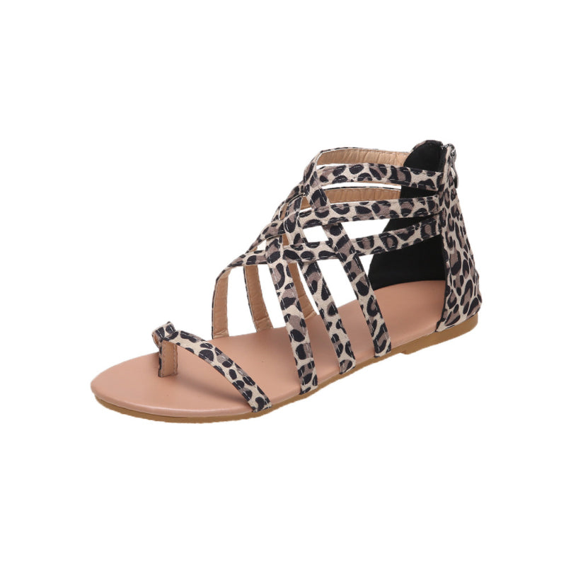 Platte zomersandalen met gekruiste bandjes en rits