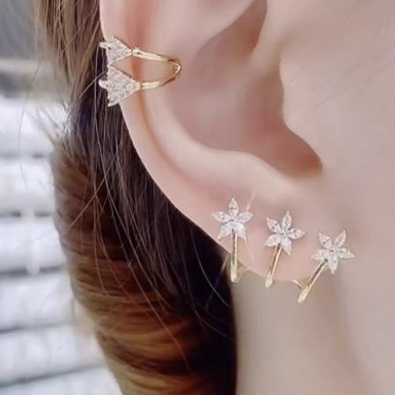 Drie bloem een doorboorde oorbellen