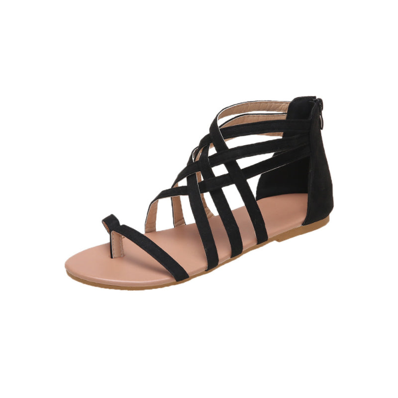 Platte zomersandalen met gekruiste bandjes en rits