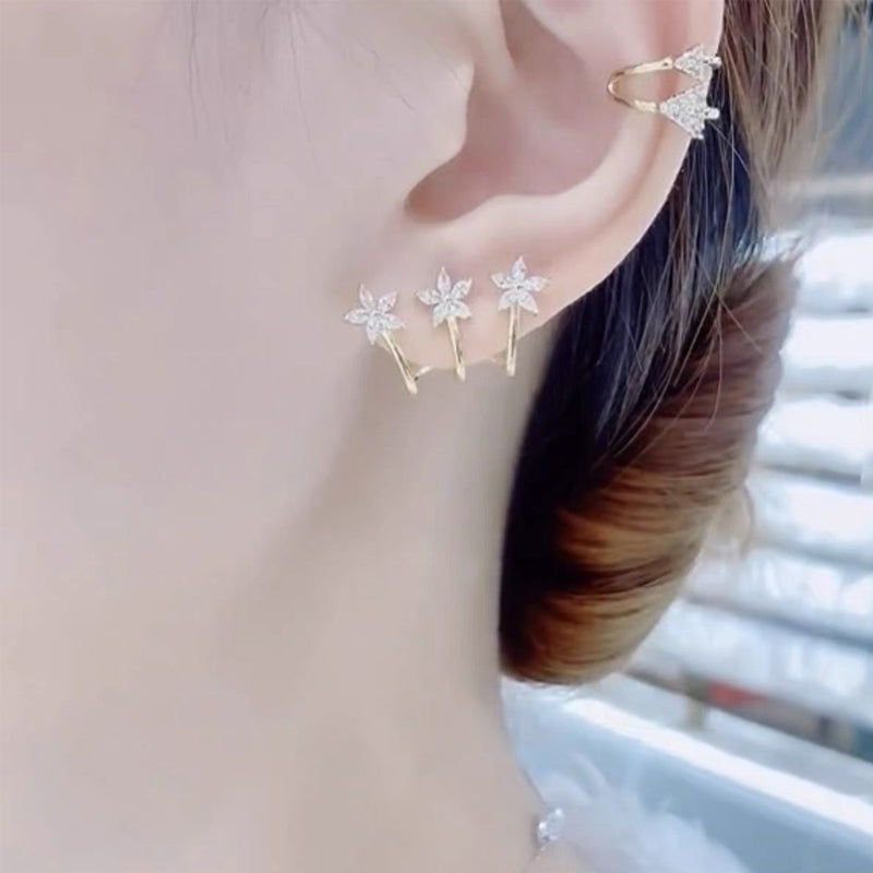 Drie bloem een doorboorde oorbellen