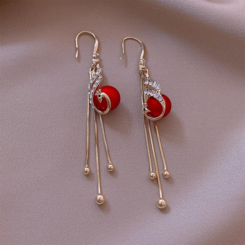 Elegante pauwenoorbellen (2 kleuren)