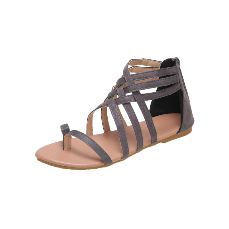 Platte zomersandalen met gekruiste bandjes en rits