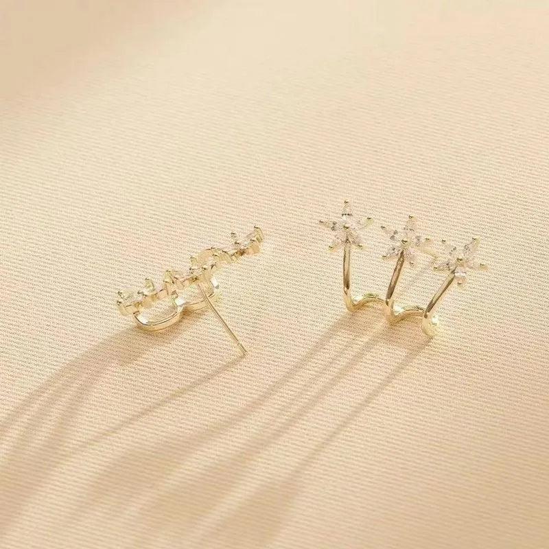 Drie bloem een doorboorde oorbellen