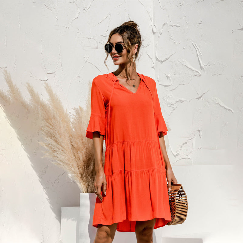 Producten Jurk in cakevorm met V-hals en uitlopende mouwen