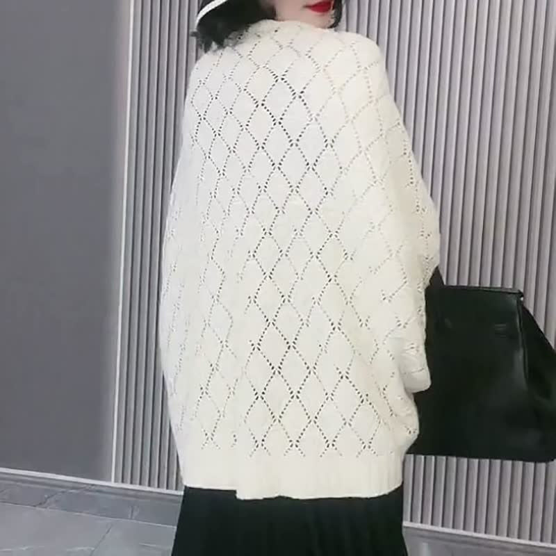 Uitgeholde gebreide sjaal