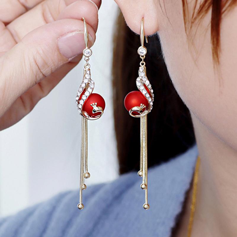 Elegante pauwenoorbellen (2 kleuren)